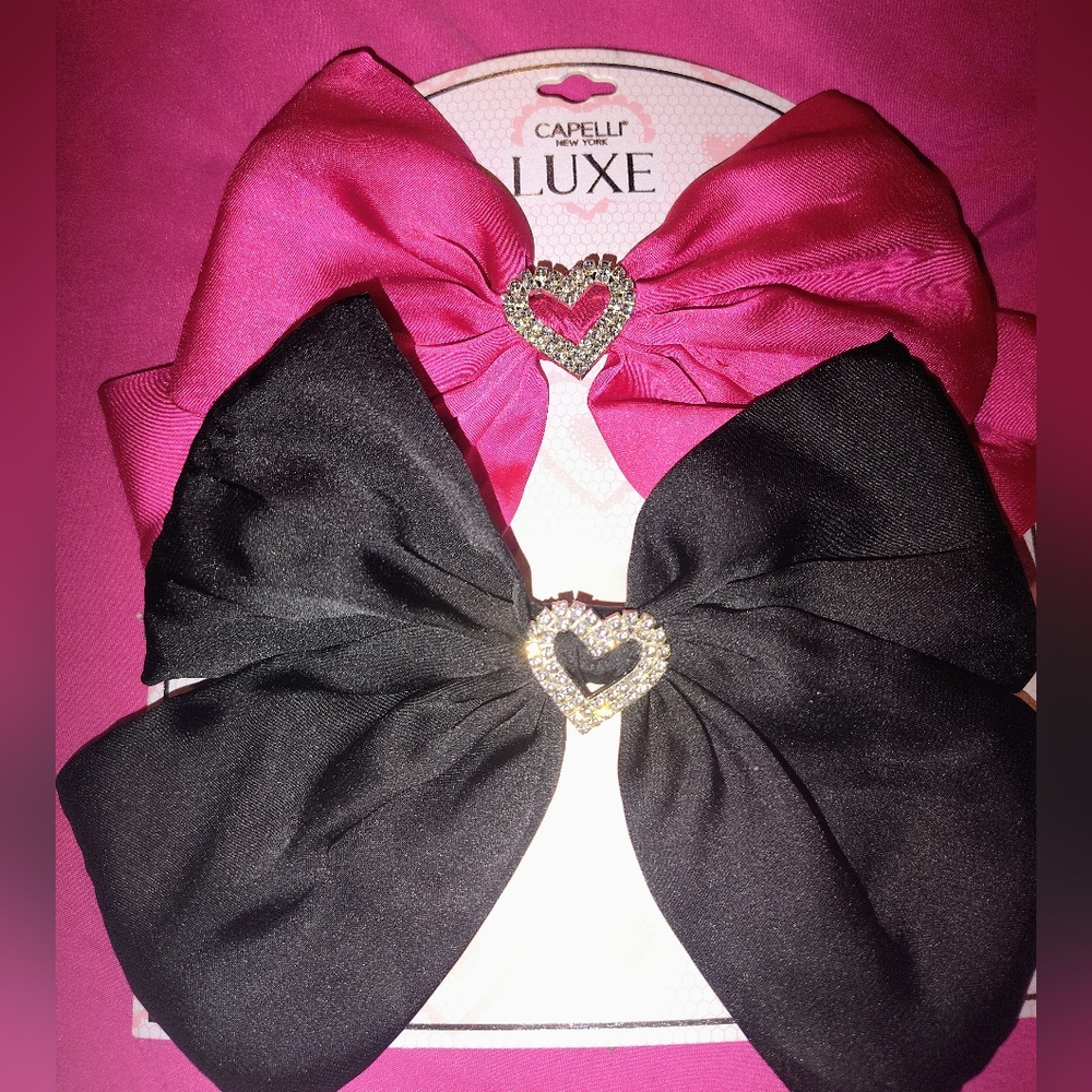 2 pack of hair bows pink and black with rhinestone heart accent in middle